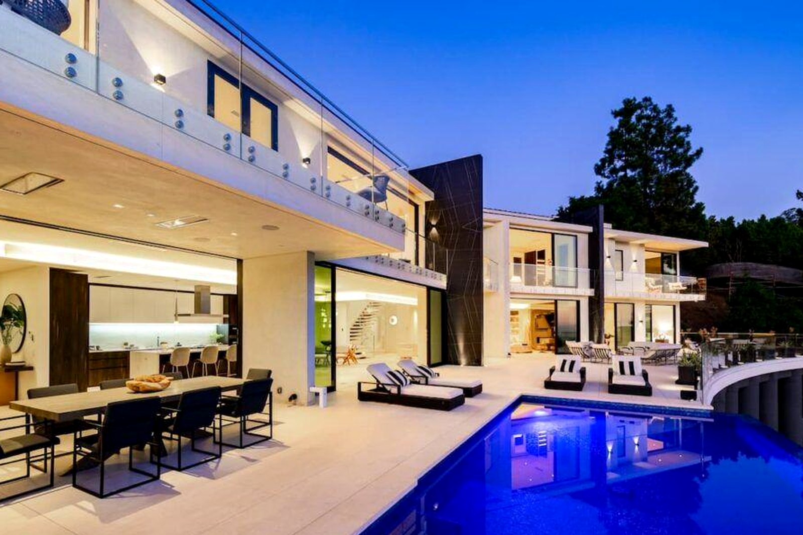 Pool terrace and open living at dusk