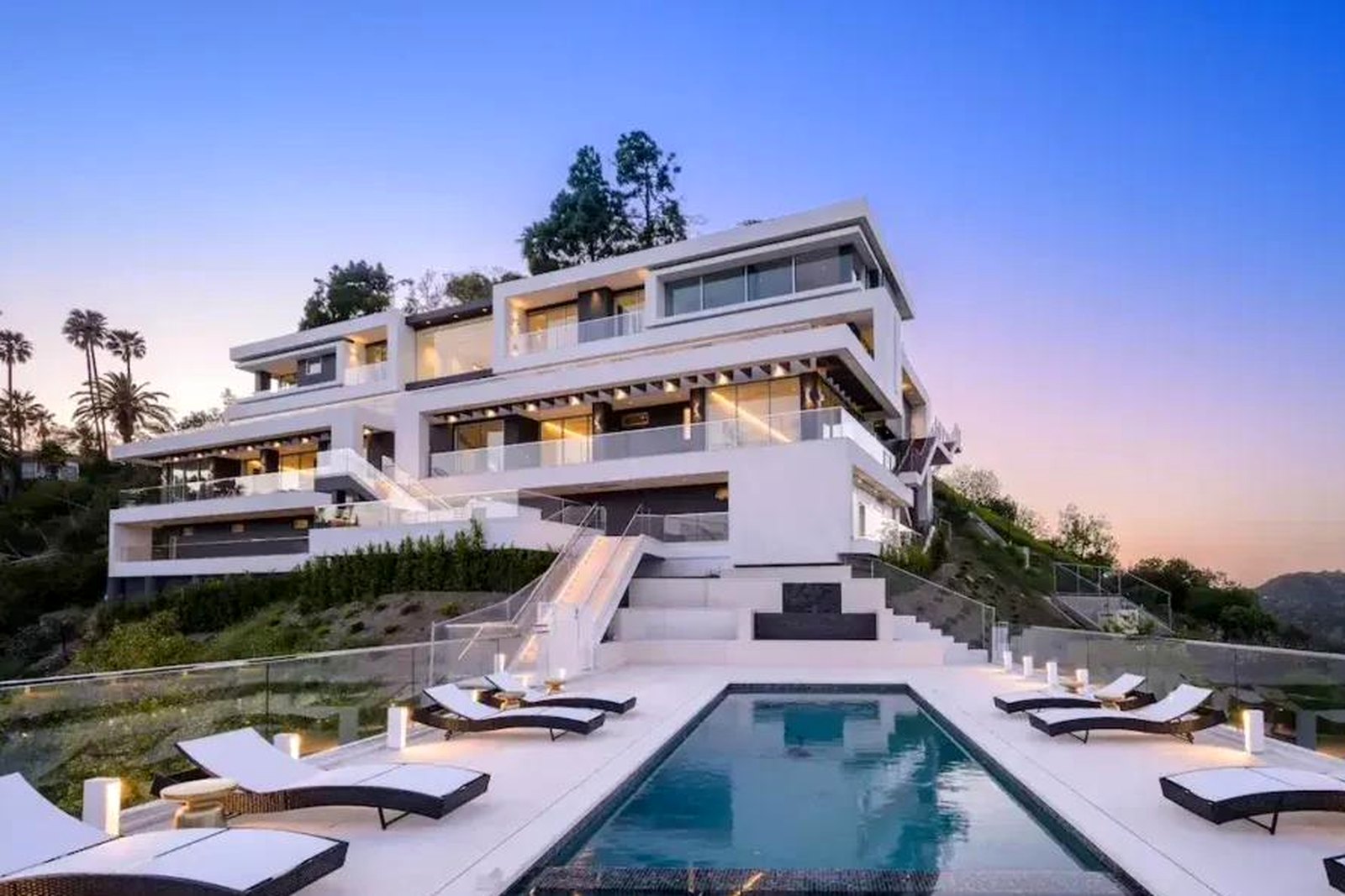 White hillside residence with terraced pool deck