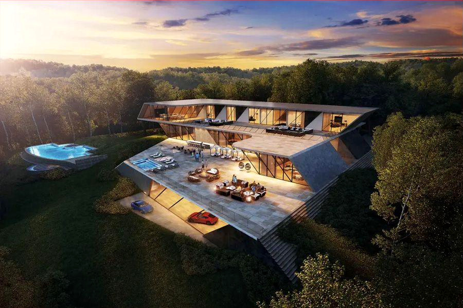 Aerial view of a hillside residence with pool and stepped terraces