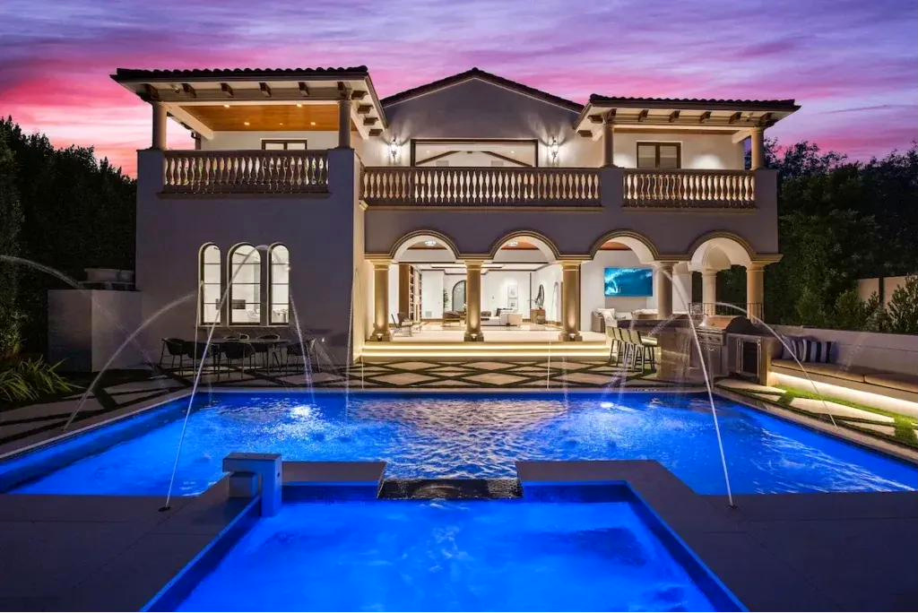 Mediterranean residence and pool at dusk