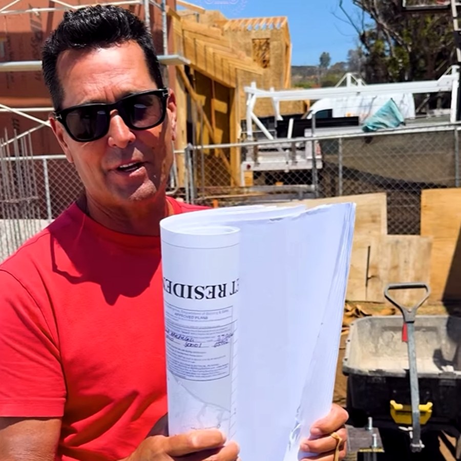 James Roman Gartner on the Pacific Palisades site holding the City of Los Angeles approved plan set